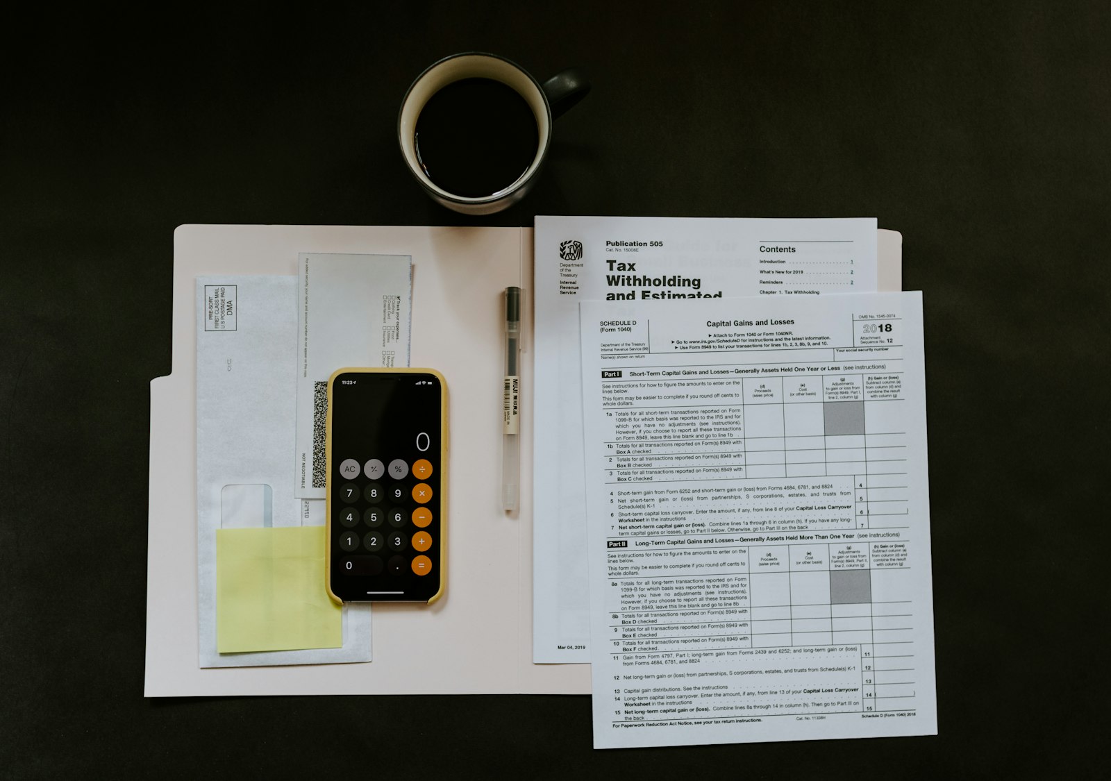 Tax preparer reviewing a client return at a tidy desk.